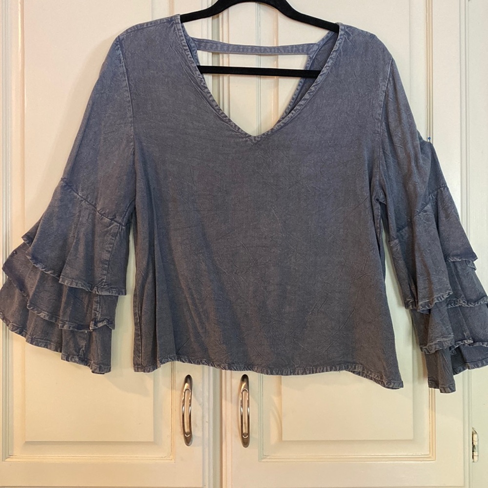 Size L, Ladies blue denim style top with ruffled, layered sleeves.